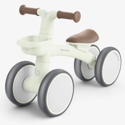 triciclo infantil branco com rodas cinzentas e punhos castanhos