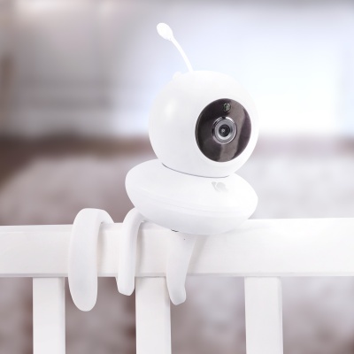 Câmara de segurança branca em forma de personagem com lente preta