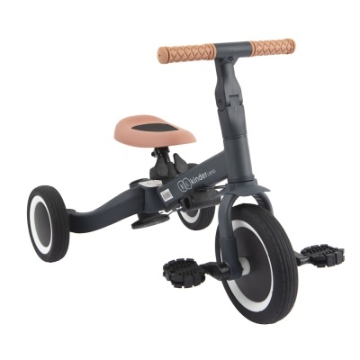 Triciclo para crianças preto com assento e punhos cor de rosa claro e rodas pretas com bordas brancas