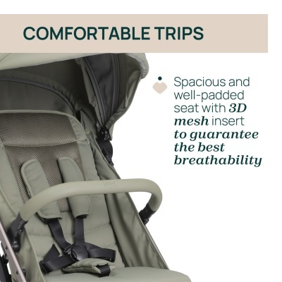 Carrinho de bebé verde com assento acolchoado e barra de proteção forrada