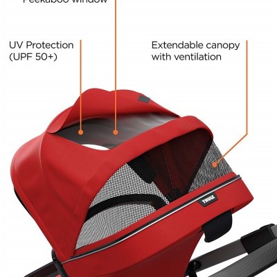Carrinho de bebé vermelho com dossel extensível e proteção UV