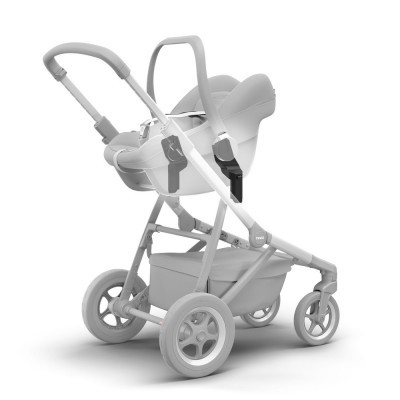 Carrinho de bebé cinzento com assento destacável tipo ovo e cesto inferior.