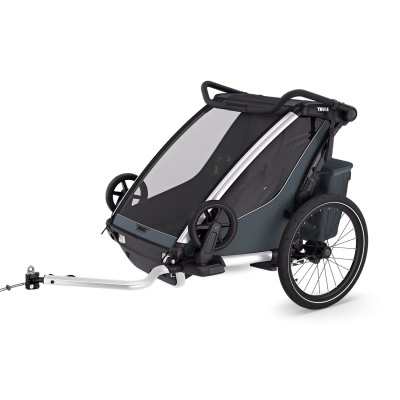 Carrinho de criança Thule para bicicletas preto e cinza com rodas grandes e estrutura metálica.