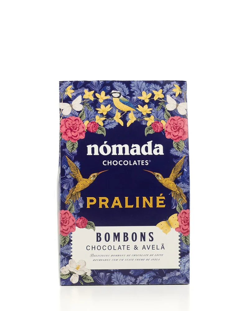 Bombons Praliné Nómada 100Gr Embalagem de bombons Nómada Praliné chocolate e avelã com design floral e pássaros