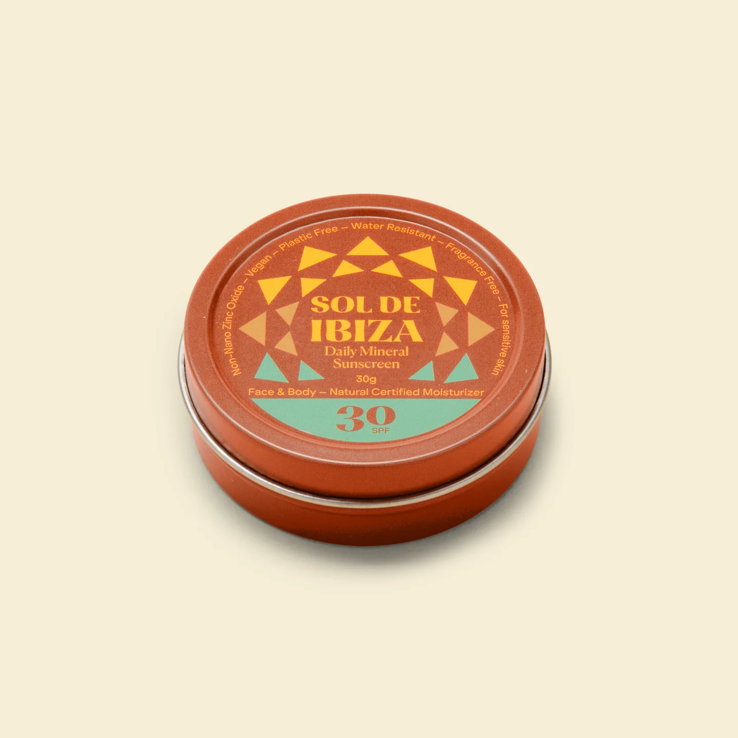 Lata redonda alaranjada com tampa decorada e texto de protetor solar