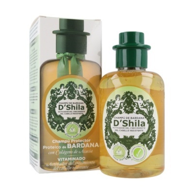 Champô protetor D'Shila com embalagem verde e ambar