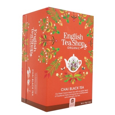 Caixa de chá chai preto English Tea Shop em fundo laranja com decoração floral