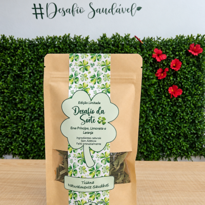 Embala de tisana com design de trevos verdes e texto Desafio da Sorte