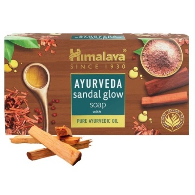 Embalagem retangular castanha de sabão Ayurveda Sandal Glow Himalaya com imagens de pau de sândalo e óleo