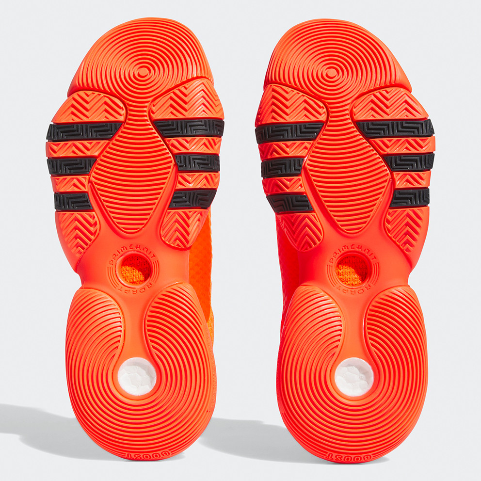 Solado de ténis laranja com detalhes pretos e padrão circular