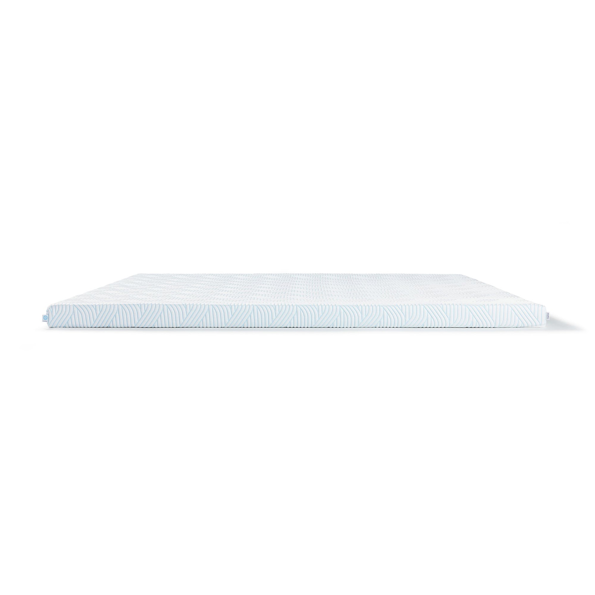 Colchão branco com padrão em relevo e lateral azul clara com desenho geométrico