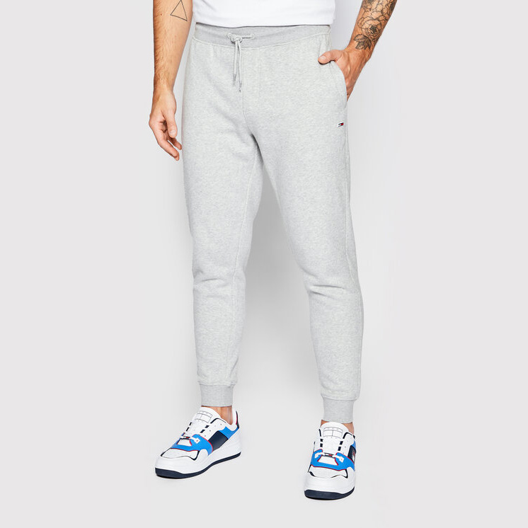 Calças de treino cinza claro com cordão na cintura e punhos ajustados