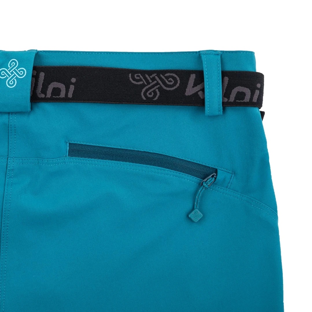 Calças turquesa com bolso de fecho e cinto preto com texto kalni.
