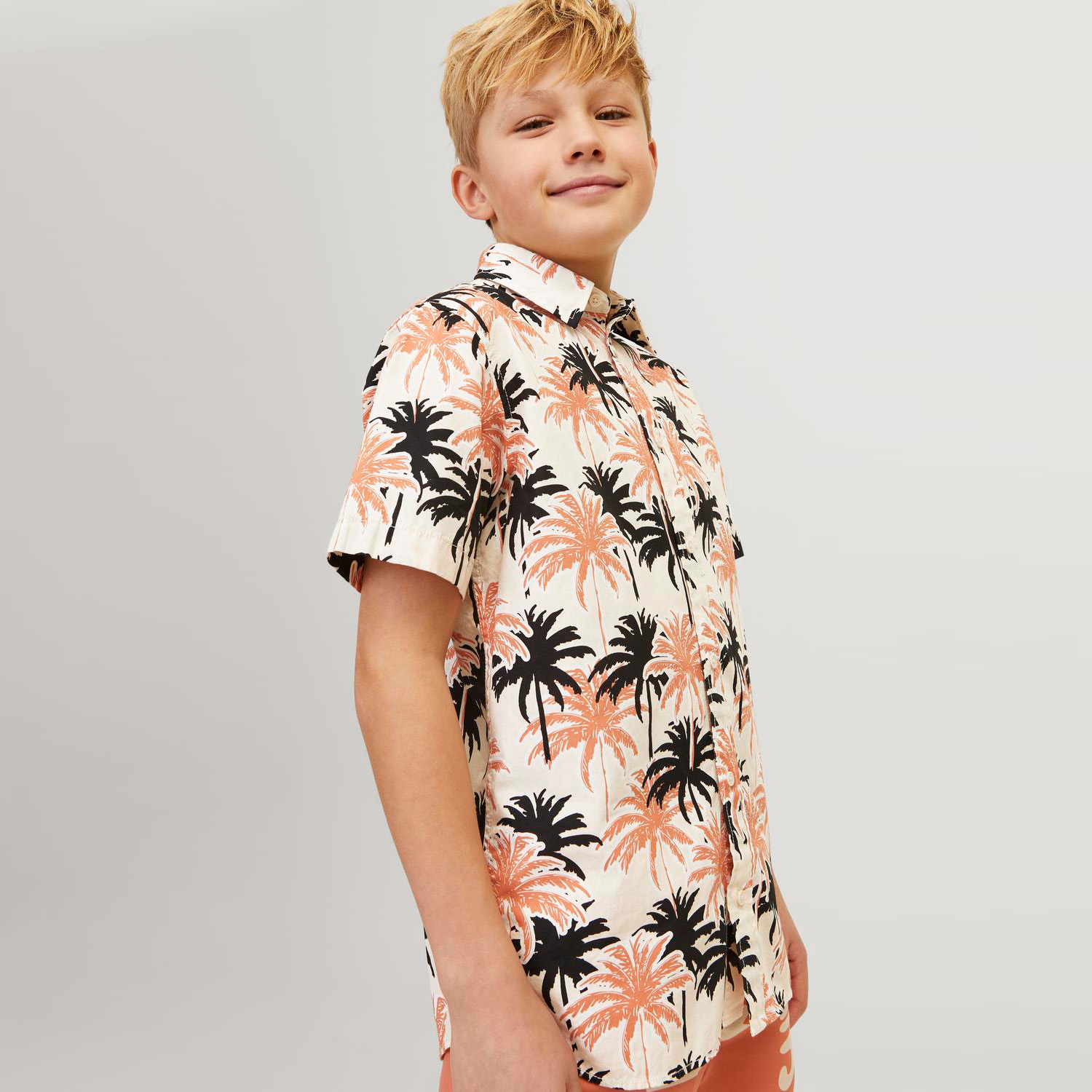 Camisola de criança com padrão de palmeiras laranja e preto