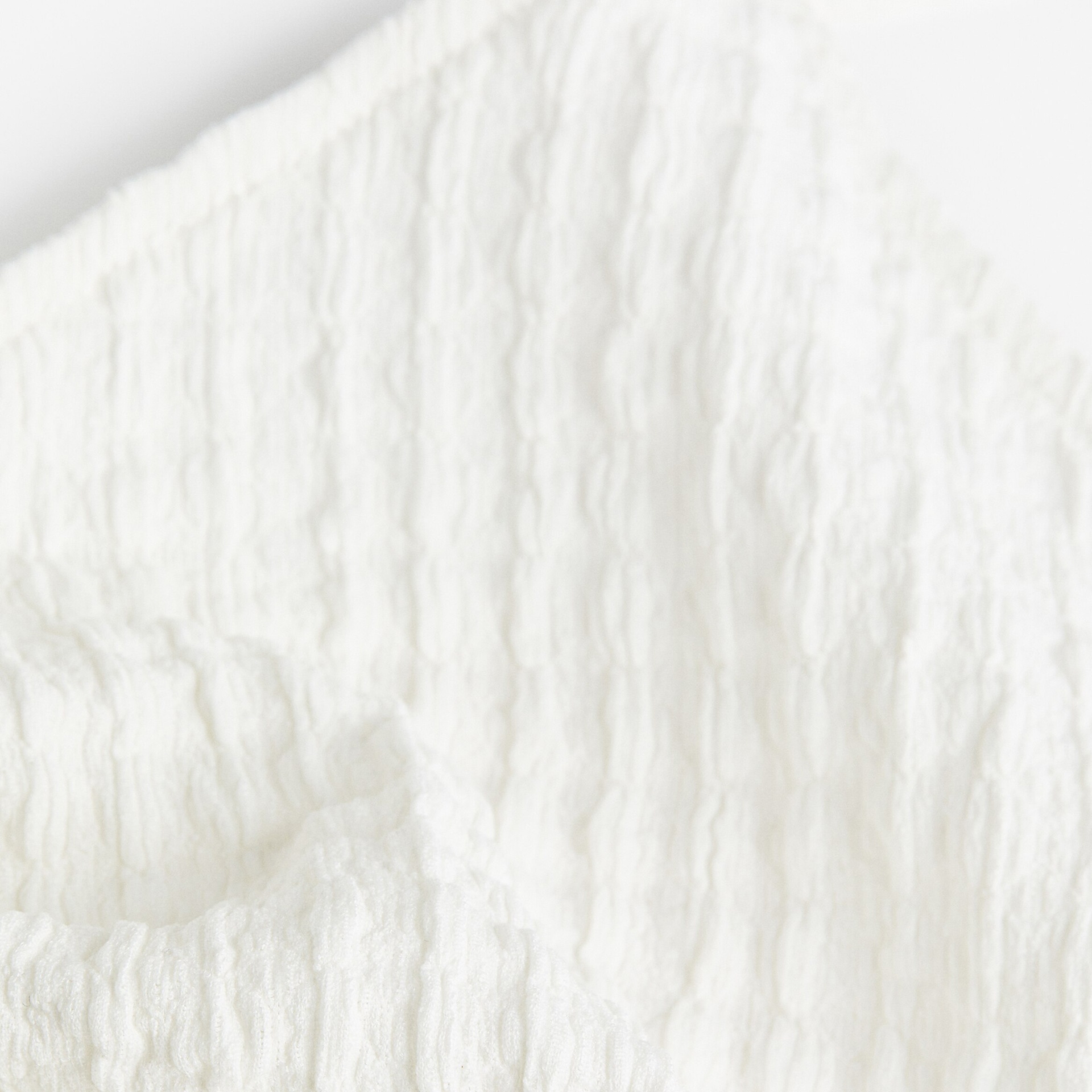 Detalhe de tecido branco texturizado