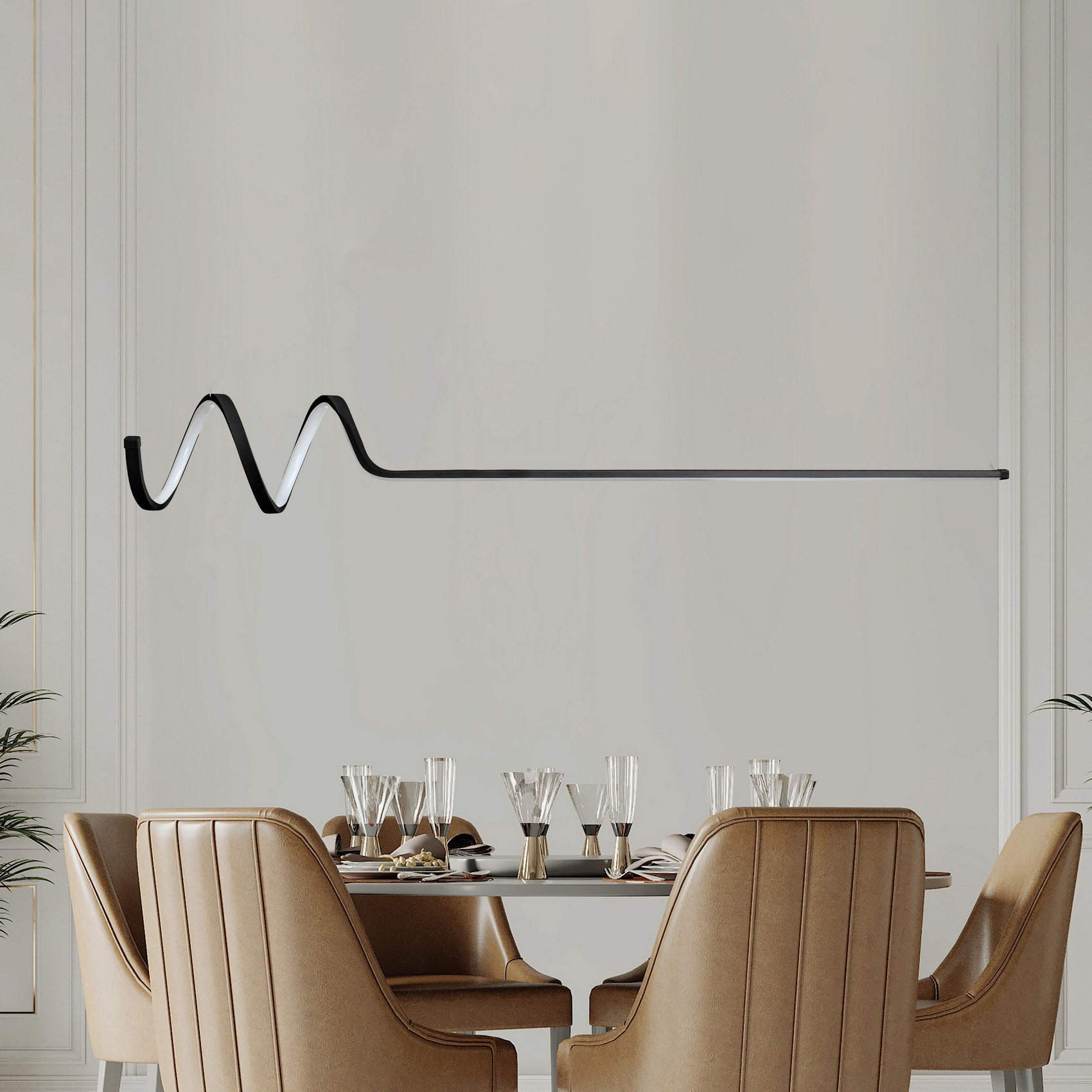 Mesa de jantar redonda com cadeiras em pele bege e copos de vidro num ambiente branco com plantas