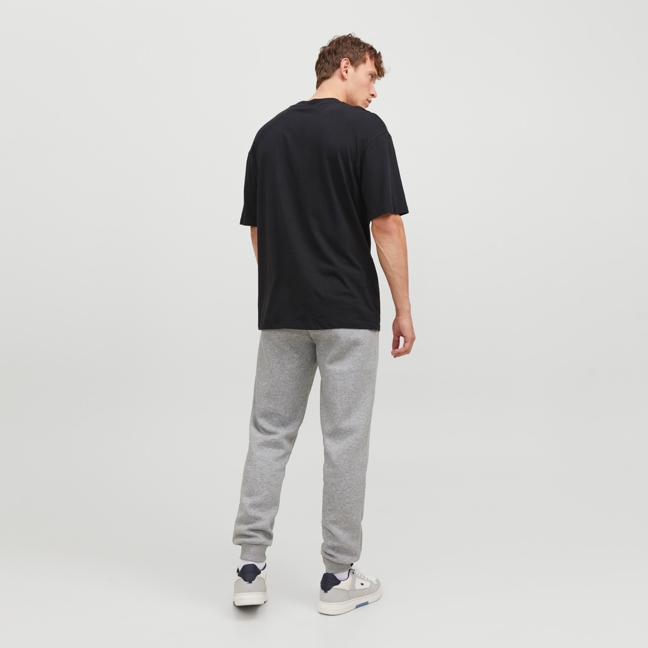 Calças de treino cinza claro com punhos