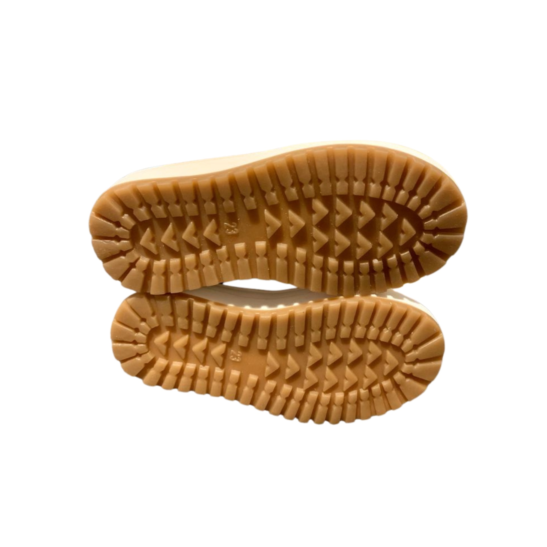 Solas de sapatos castanhos claros com padrão em relevo
