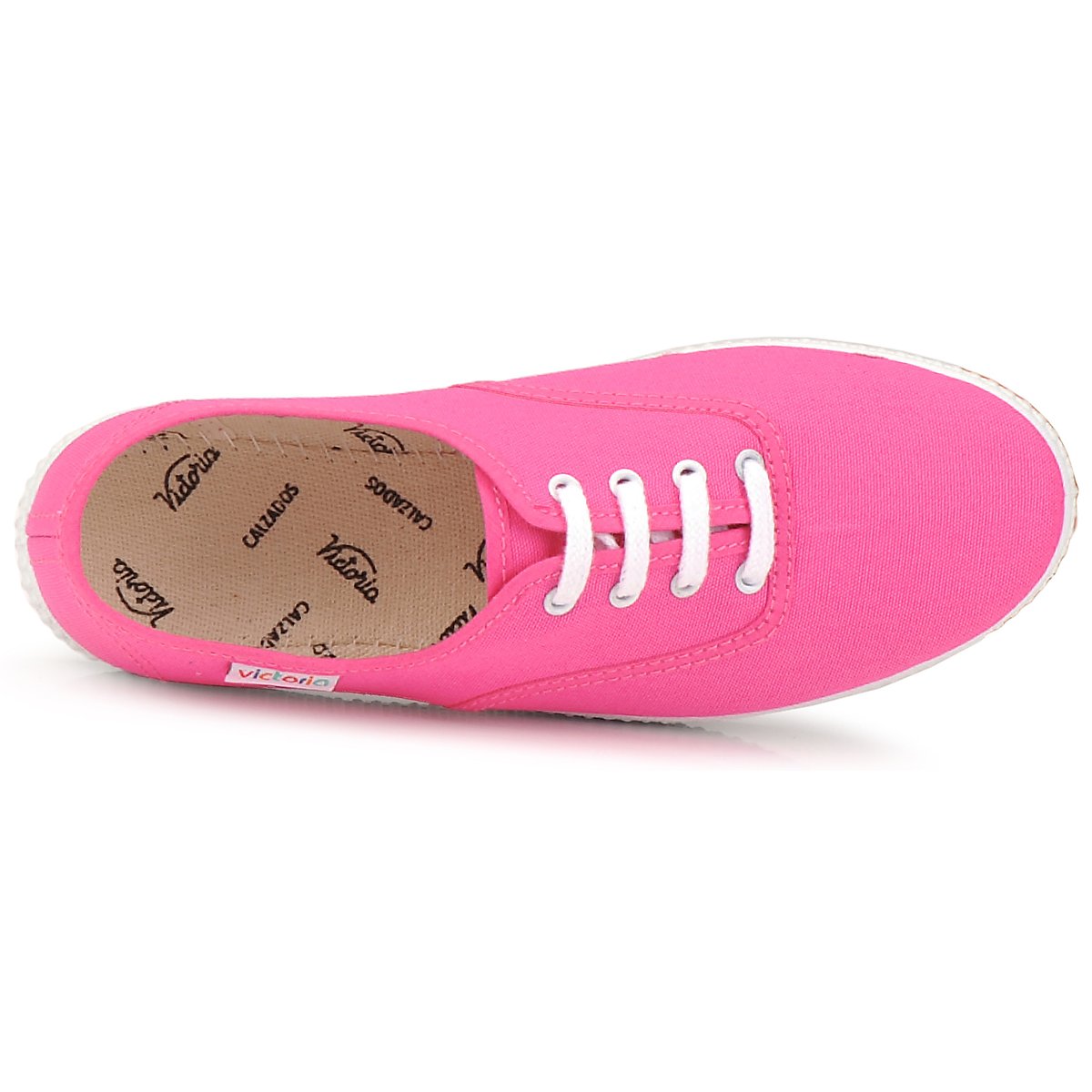 Ténis cor de rosa com atacadores brancos e sola branca visto de cima