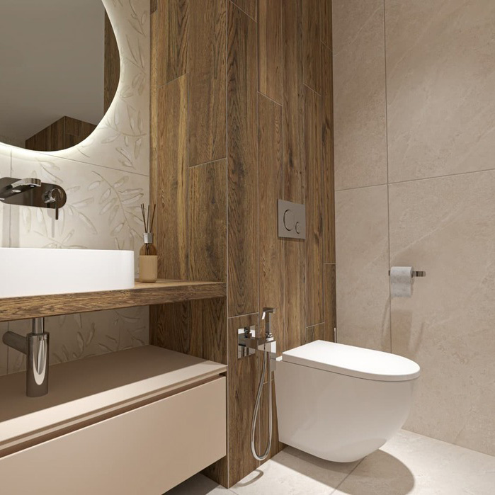 Casa de banho com sanita suspensa branca, lavatório branco e parede revestida com azulejo que imita madeira