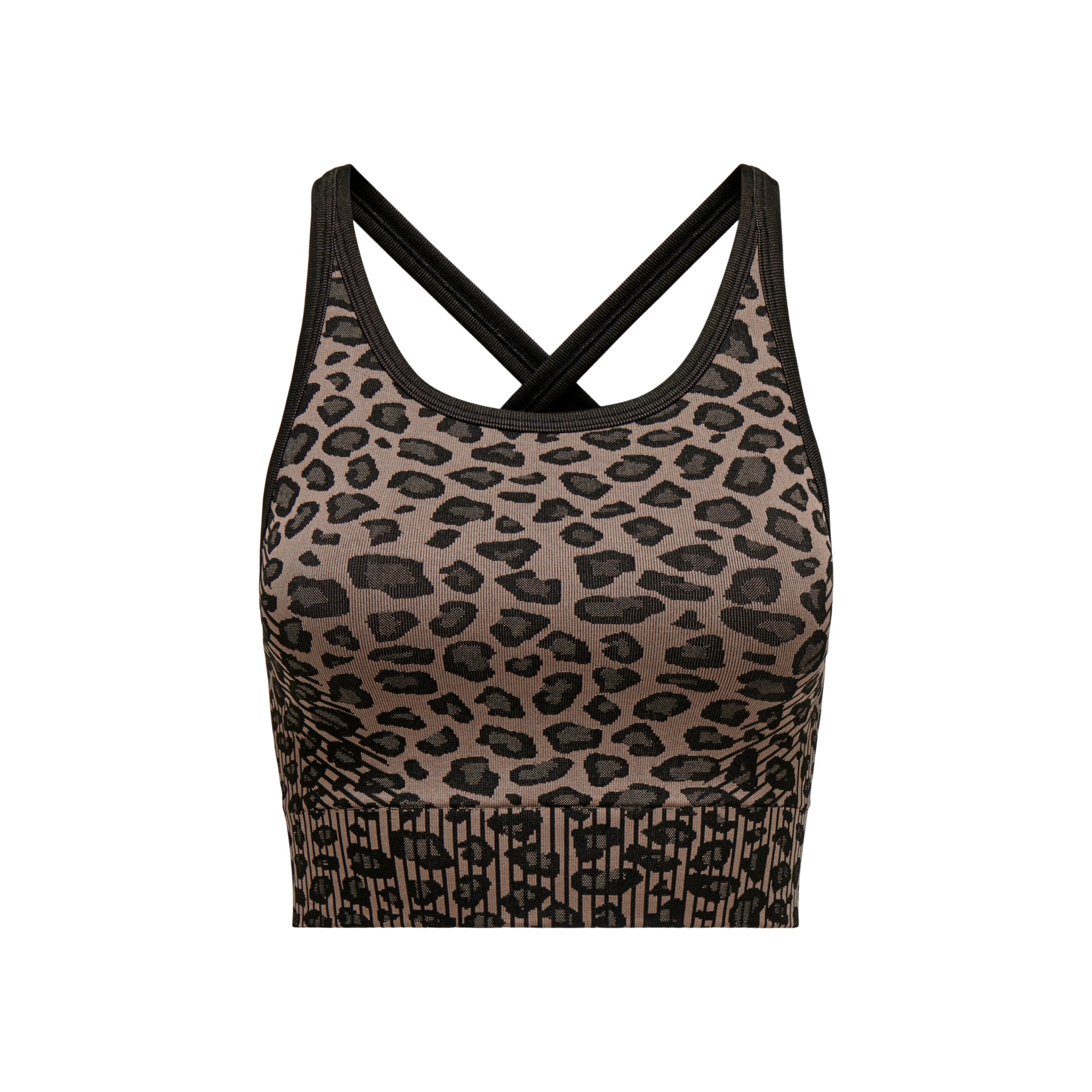 Top desportivo castanho com padrão animal print e alças pretas cruzadas