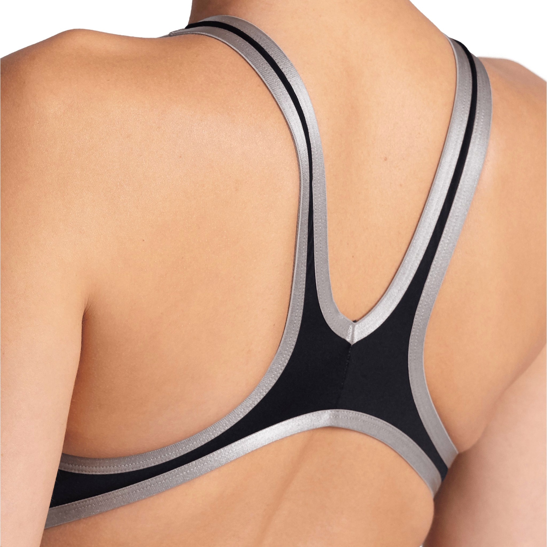 Parte de trás de top desportivo preto com detalhes prateados