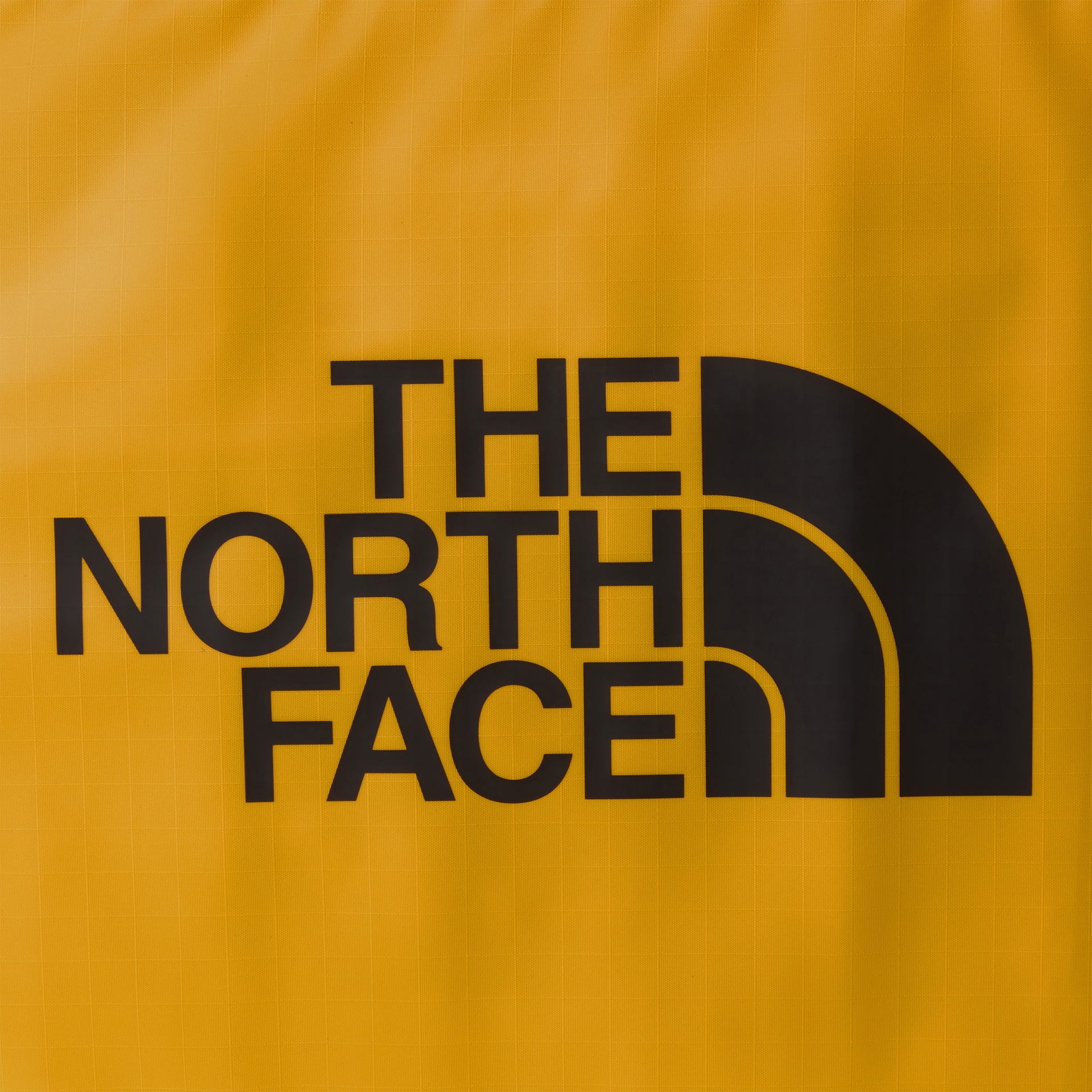 Logótipo preto THE NORTH FACE em tecido amarelo quadriculado