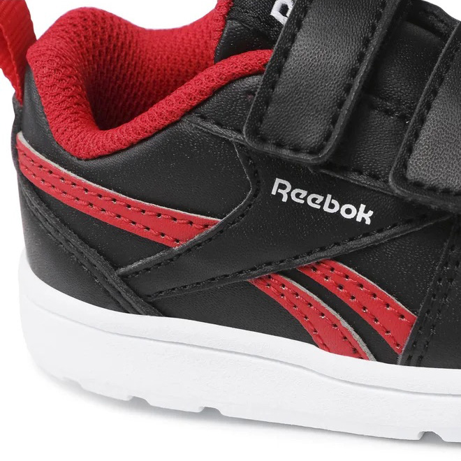 Ténis desportivo infantil preto e vermelho com sola branca e logótipo Reebok na lateral
