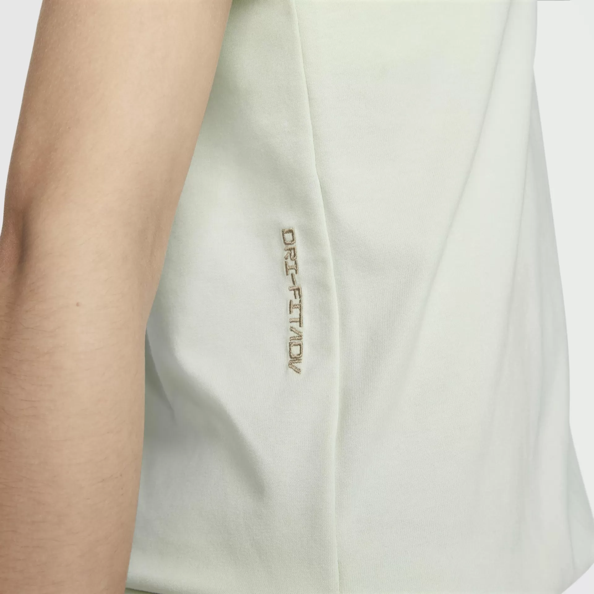 T-shirt branca com bordado bege na lateral