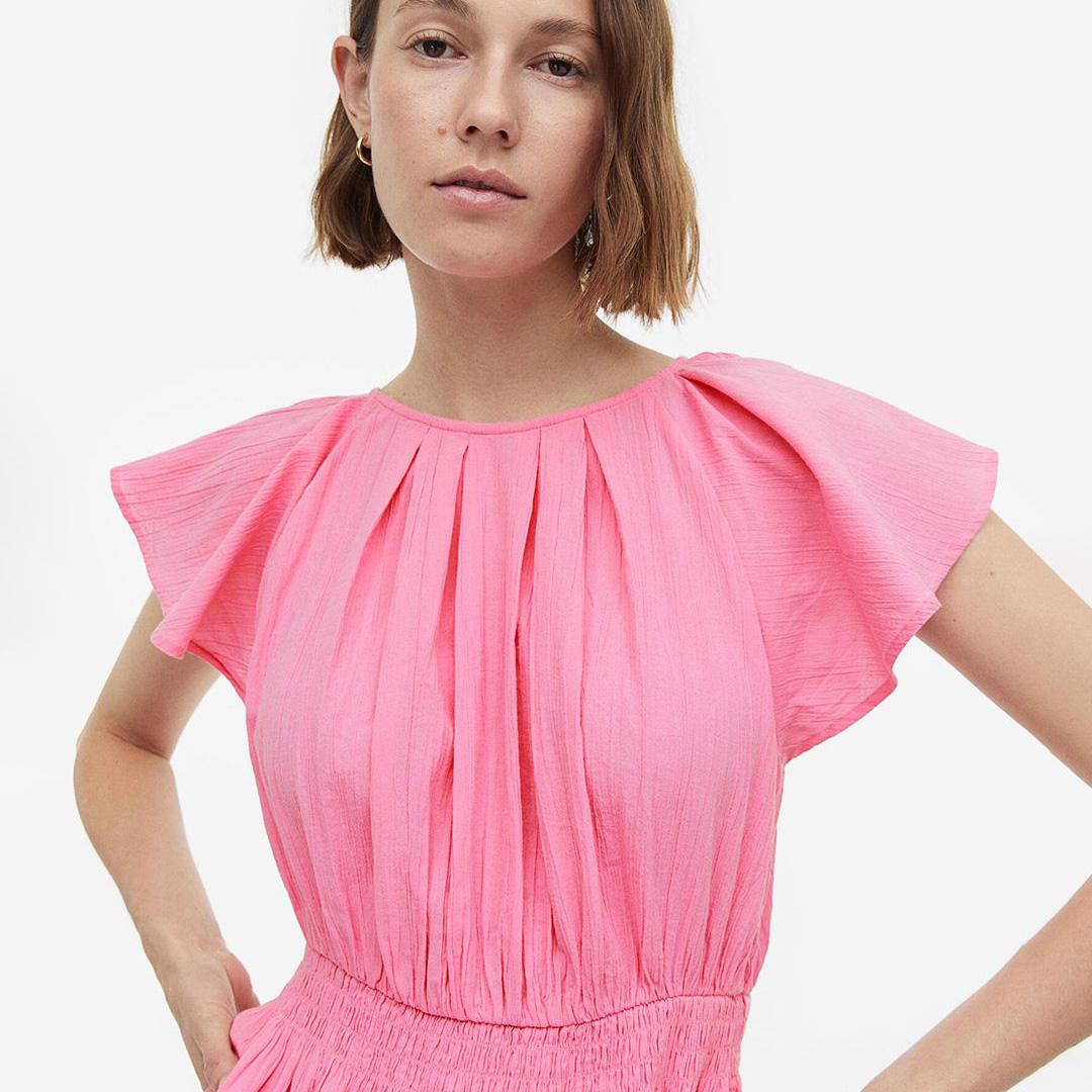Blusa rosa feminina com mangas curtas largas e cintura elástica