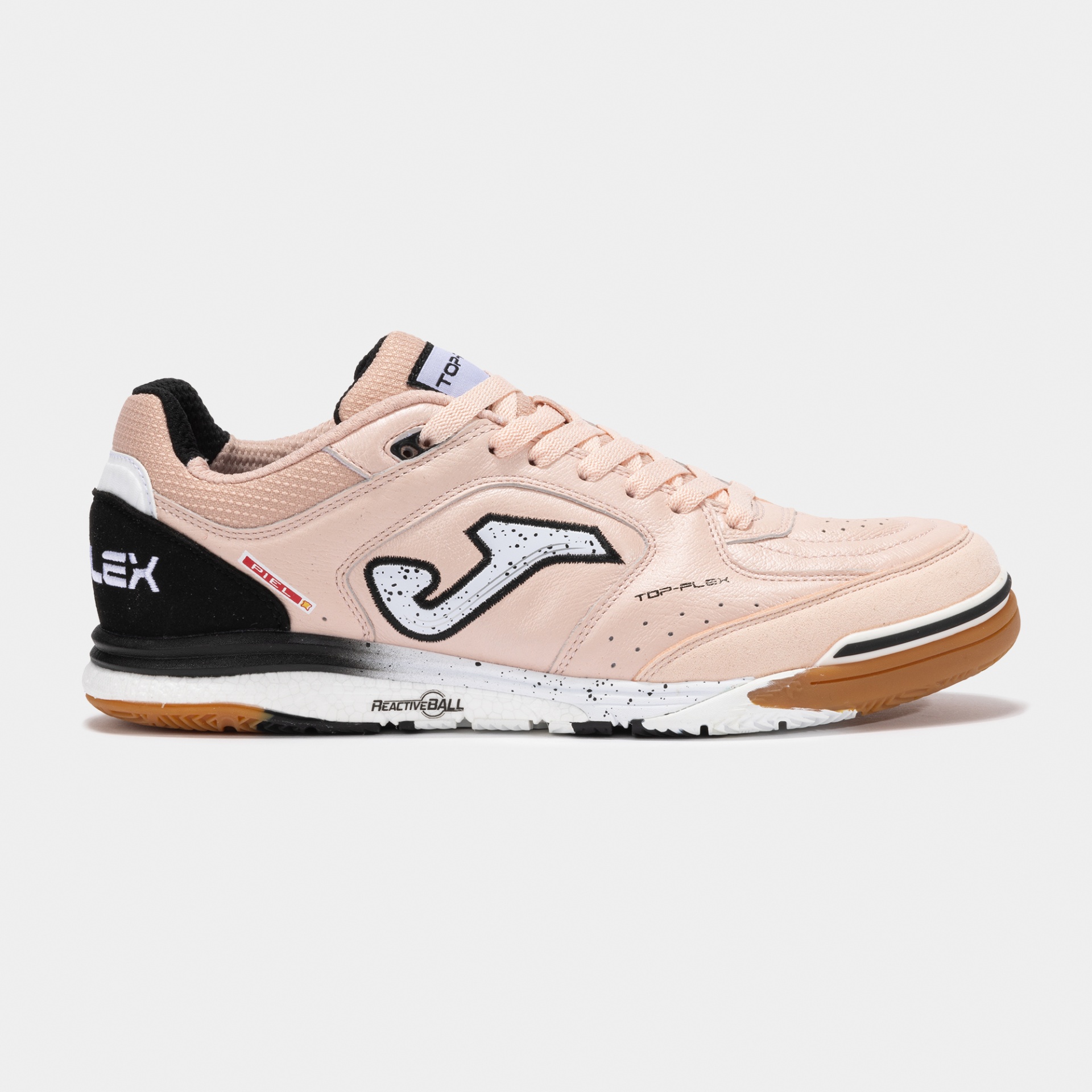 Ténis desportivo cor de rosa com sola castanha e detalhes em preto e branco