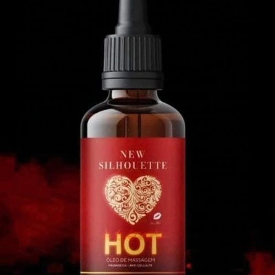 Frasco castanho com óleo de massagem e rótulo vermelho com texto e coração dourado