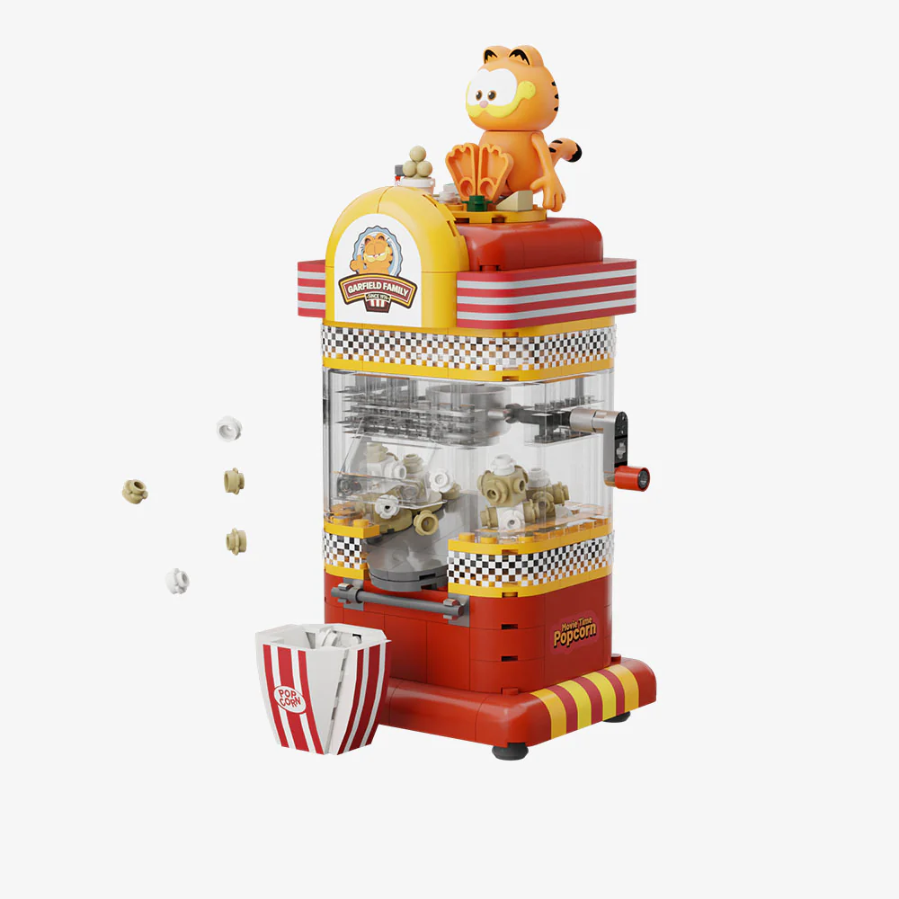Máquina de fazer pipocas de brinquedo com o Garfield em cima e balde à frente