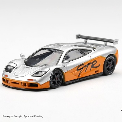 Miniatura de carro desportivo prateado e laranja com asa traseira preta