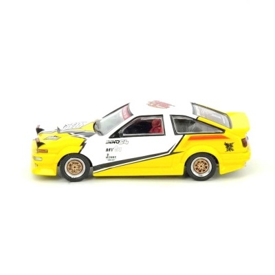 Miniatura de carro branco e amarelo com rodas douradas e decalques