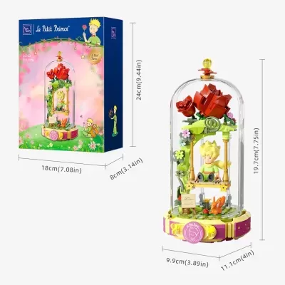 Conjunto LEGO Le Petit Prince com figura do Pequeno Príncipe num baloiço dentro de cúpula transparente com flores e rosas vermelhas