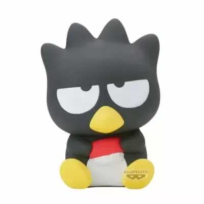 Figura de personagem preto com olhos grandes e bico amarelo sobre fundo branco