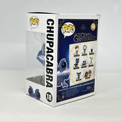 Figura Funko Pop! Chupacabra do filme The Crimes of Grindelwald na embalagem.