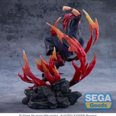 Figura colecionável de personagem com fogo vermelho e amarelo em base de pedras