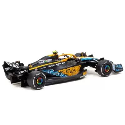 modelo miniatura carro Fórmula 1 preto azul amarelo com padrões gráficos e inscrições