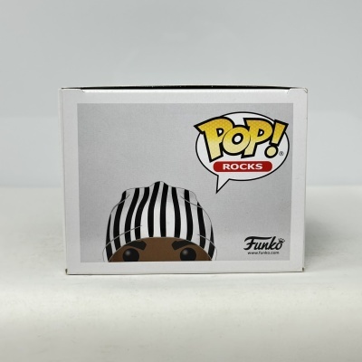 Caixa branca de Funko Pop com personagem de gorro às riscas e texto POP! ROCKS.