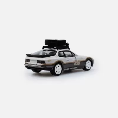 Miniatura de carro desportivo branco com rodas sobresselentes no tejadilho