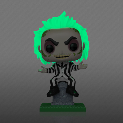 Figura colecionável estilo Funko Pop com cabelo verde luminescente e fato às riscas preto e branco sentado numa campa