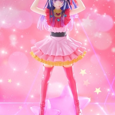 Figura colecionável de personagem feminina com vestido rosa em base de estrelas