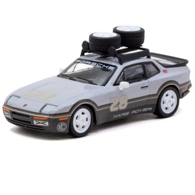 Miniatura de carro Porsche cinza com rodas extras no tejadilho