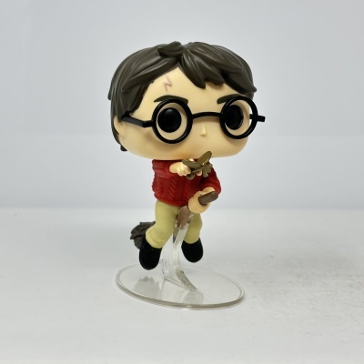 Figura Funko Pop de Harry Potter a voar numa vassoura com chave dourada