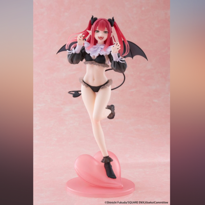 Figura de personagem feminina com cabelo rosa, asas e base em forma de coração.