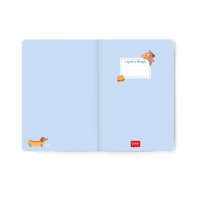 Livro aberto com capa interior azul clara, ilustrações de cães e comida, texto I have a dream.