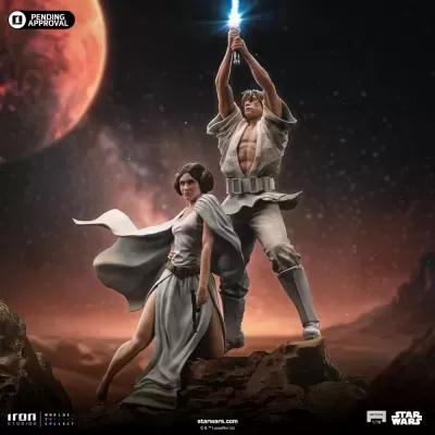 Estátua de Luke Skywalker e Leia Organa em cenário espacial com planeta vermelho