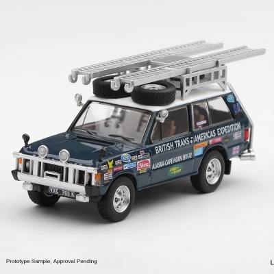 Miniatura de carrinha Land Rover azul escuro com escadas no teto e autocolantes de expedição
